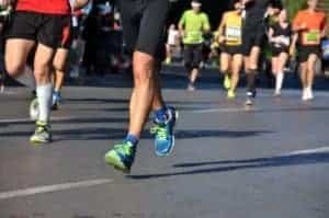 Marathon running race, people feet on road