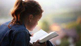 Image of girl reading Bible