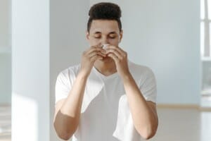 Photo of person suffering form allergies