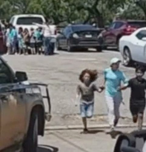 Cell phone photo of Angeli Rose Gomez running with her chidren from Robb Elementary School shooting