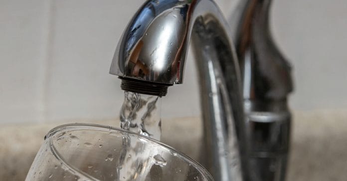 lead-poisoning-featured-web Image of water running from faucet into glass