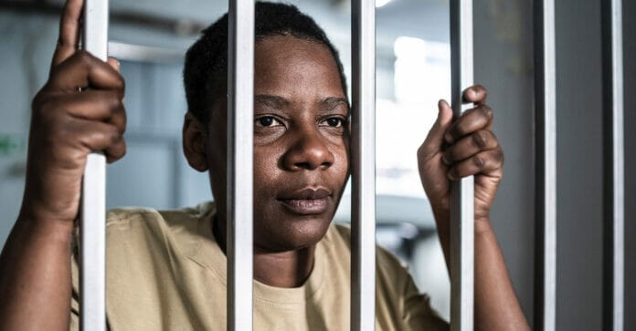 black woman behind bars