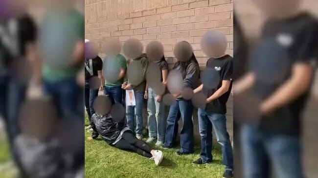 Racist teens in Idaho school spell out N-Word while posing for picture behind mixed race girl
