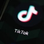 TikTok app icon on smartphone screen | Ivan Radic | Flickr (CC BY 2.0 DEED Attribution 2.0 Generic)