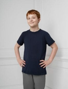 Max modeling the Fidget-T. An 11-year-old with autism founded his own business and invented a range of t-shirts for kids with sensory issues - selling more than 700 in their first release. PHOTO BY PHILLIP LYNAM/SWNS 